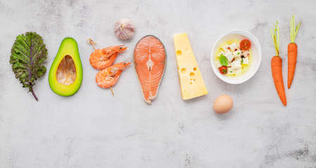 Ketogenic low carbs diet concept. Ingredients for healthy foods selection set up on white concrete background.の写真素材