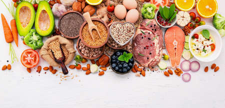 Ketogenic low carbs diet concept. Ingredients for healthy foods selection set up on white wooden background.の写真素材