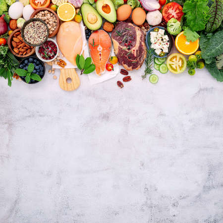 Ketogenic low carbs diet concept. Ingredients for healthy foods selection set up on white concrete background.の写真素材