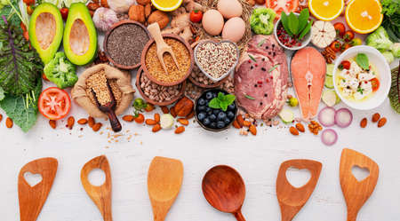 Ketogenic low carbs diet concept. Ingredients for healthy foods selection set up on white wooden background.の写真素材