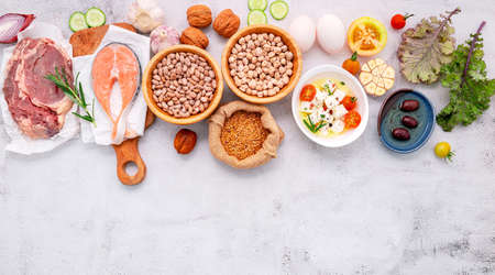 Ketogenic low carbs diet concept. Ingredients for healthy foods selection set up on white concrete background.の写真素材