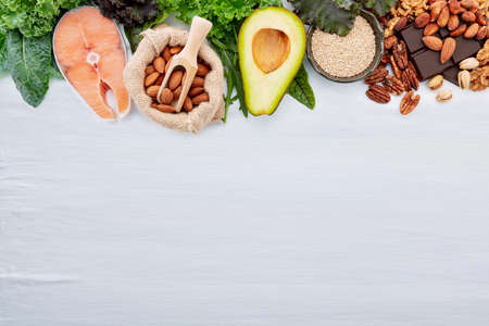 Ketogenic low carbs diet concept. Ingredients for healthy foods selection set up on white concrete background.の写真素材