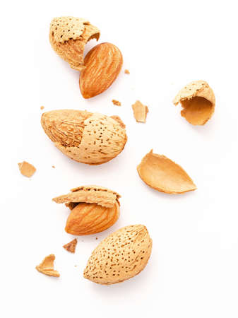 Close up group of almonds nut with shell  and cracked almonds shell isolated on white background.の写真素材