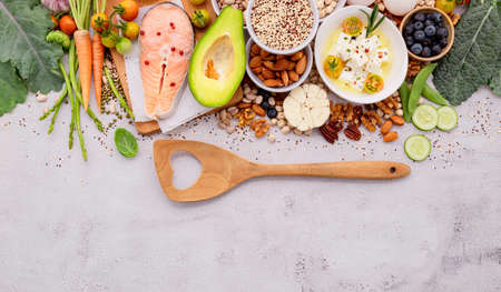 Ketogenic low carbs diet concept. Ingredients for healthy foods selection set up on white concrete background.の写真素材