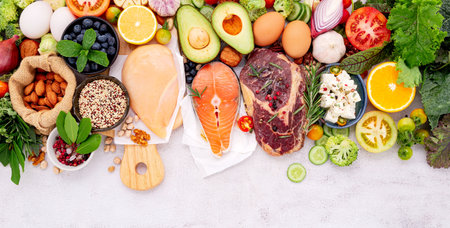Ketogenic low carbs diet concept. Ingredients for healthy foods selection set up on white concrete background.の写真素材