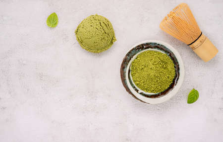 Matcha green tea ice cream with green tea powder and mint leaves  setup on white stone background . Summer and Sweet menu concept.の写真素材