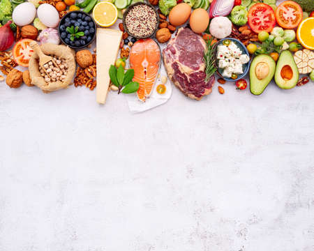 Ketogenic low carbs diet concept. Ingredients for healthy foods selection set up on white concrete background.の写真素材
