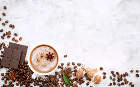 Background of dark roasted coffee bean and with dark chocolate on white concrete background with copy space.の写真素材