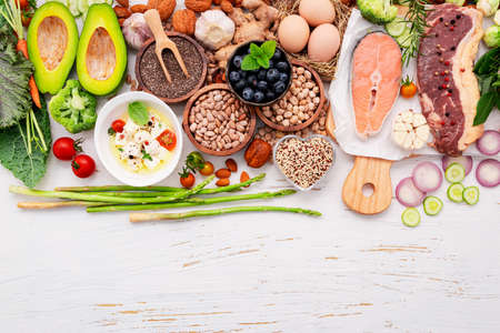 Ketogenic low carbs diet concept. Ingredients for healthy foods selection set up on white wooden background.の写真素材