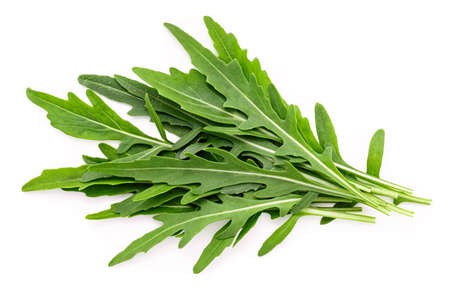 Arugula leaves isolated on white background. Closeup fresh wild rocket leaves on white background top view.の写真素材