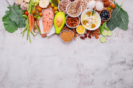 Ketogenic low carbs diet concept. Ingredients for healthy foods selection set up on white concrete background.の写真素材