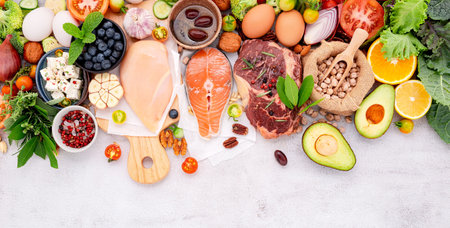 Ketogenic low carbs diet concept. Ingredients for healthy foods selection set up on white concrete background.の写真素材