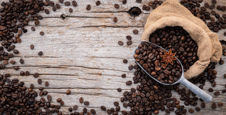 Background of dark roasted coffee beans with scoops setup on wooden background with copy space.の写真素材