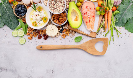 Ketogenic low carbs diet concept. Ingredients for healthy foods selection set up on white concrete background.の写真素材