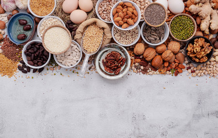 Ingredients for the healthy foods selection. The concept of superfoods set up on white shabby concrete background with copy space.の写真素材