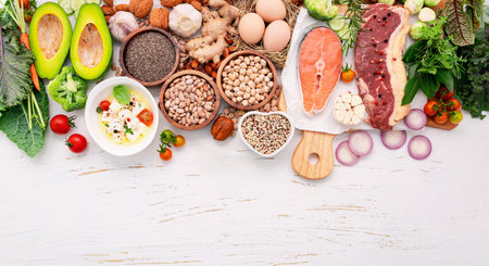Ketogenic low carbs diet concept. Ingredients for healthy foods selection set up on white wooden background.の写真素材