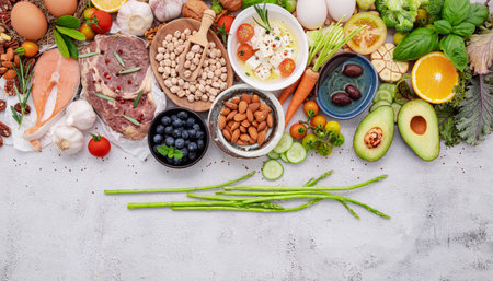 Ketogenic low carbs diet concept. Ingredients for healthy foods selection set up on white concrete background.の写真素材