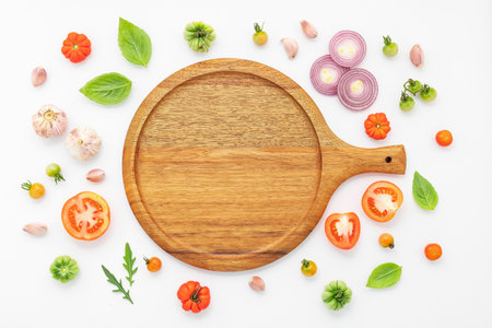 The ingredients for homemade pizza set up on white concrete background.の写真素材
