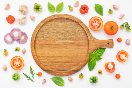 The ingredients for homemade pizza set up on white concrete background.の写真素材
