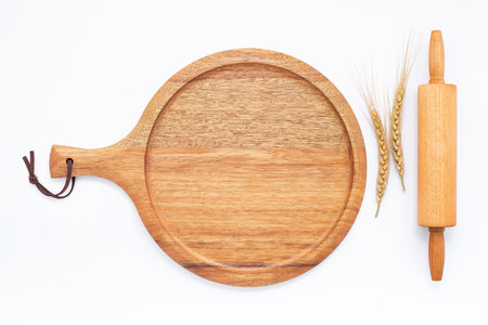Empty wooden pizza platter set up on isolated on white background. Pizza tray on  on white background flat lay and copy space.の写真素材