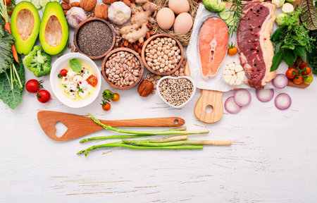 Ketogenic low carbs diet concept. Ingredients for healthy foods selection set up on white wooden background.の写真素材