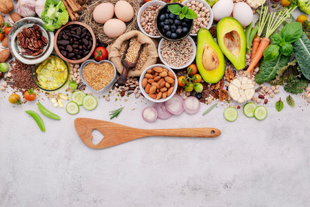 Ingredients for the healthy foods selection. The concept of superfoods set up on white shabby concrete background with copy space.の写真素材