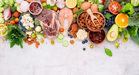 Ketogenic low carbs diet concept. Ingredients for healthy foods selection set up on white concrete background.の写真素材