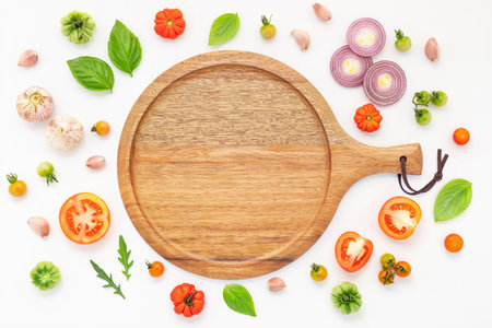 The ingredients for homemade pizza set up on white concrete background.の写真素材