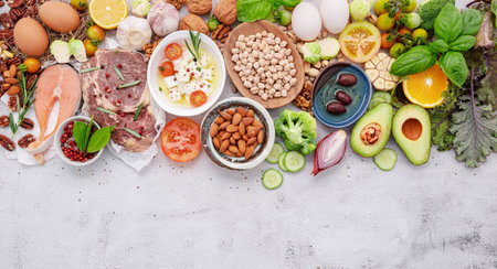 Ketogenic low carbs diet concept. Ingredients for healthy foods selection set up on white concrete background.の写真素材