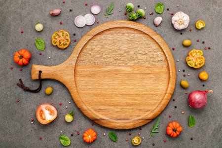 The ingredients for homemade pizza set up on white concrete background.の写真素材