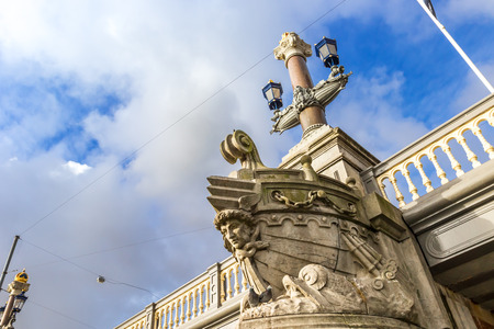Beautiful view of Amsterdam canals with bridges and typical flemish houses in sunny weather with blue sky.の写真素材