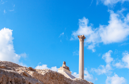 Pompey's pillar and ancient sphinx statue roman triumphal column in Alexandria, Egyptの写真素材
