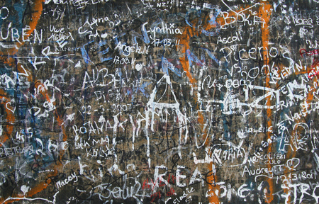 tourists painted the wall in different languages, abstract background for design, wallpaperの写真素材