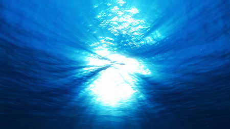 light underwater abstract blue ocean backgroundの写真素材