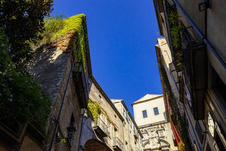 Medieval stone stairs leading to the church of Sant Marti Sacosta in the old town of Girona, Girona landmarks, Catalonia, Spain.の写真素材