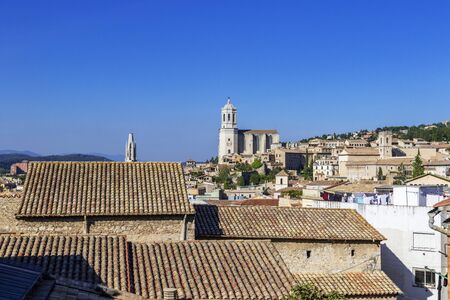 Girona Cathedral, also known as the Cathedral of Saint Mary of Girona, aerial view of Girona city in summer day with blue sky, Girona landmarks, Catalonia, Spainの写真素材