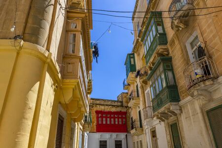 architecture, balcony, building, europe, travel, house, tourism, maltese, facade, street, malta balconies, mediterranean, landmark, cityscape, historical, island, valletta, medieval, window, historic,の写真素材