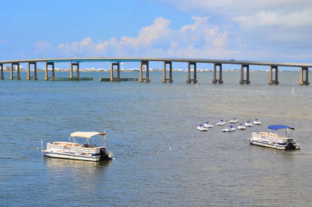 Boats in front of a large bridgeのeditorial素材