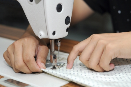 hand sewing on a machineの写真素材