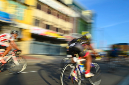 Motion blur of a group of cyclists in action during a cycling tourの写真素材