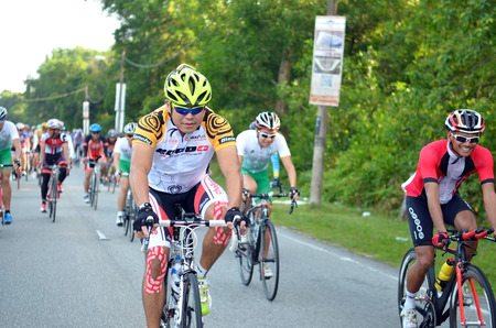 KUANTAN - FEBRUARY 6: unidentified cyclists in action during Kuantan160 on February 6, 2013 in Kuantan, Pahang, Malaysia. KUANTAN160 is a non-profit, non-race 160KM bicycle ride around Kuantan City.のeditorial素材