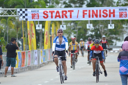 KUANTAN - FEBRUARY 6: unidentified cyclists in action during Kuantan160 on February 6, 2013 in Kuantan, Pahang, Malaysia. KUANTAN160 is a non-profit, non-race 160KM bicycle ride around Kuantan City.のeditorial素材