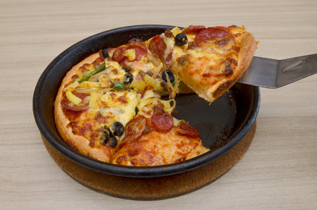 Pizza with pineapple, ham, cheese and mushroomの写真素材