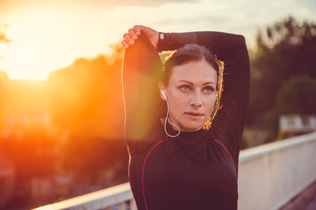 Fitness woman doing stretching exerciseの写真素材