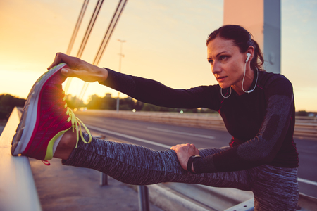 Fitness woman doing stretching exerciseの写真素材