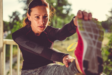 Fitness woman doing stretching exerciseの写真素材