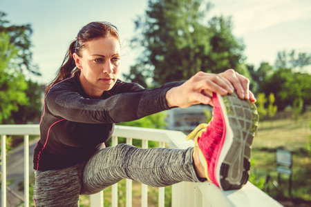 Fitness woman doing stretching exerciseの写真素材