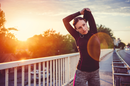 Fitness woman doing stretching exerciseの写真素材