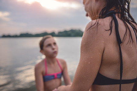 Mother skin with goosebumps from the cold after swimming in the riverの写真素材