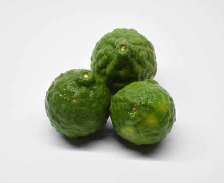 Bergamots (Other names are Kaffir lime, Citrus, Magnoliophyta, Rutaceae) fruits with leafの写真素材